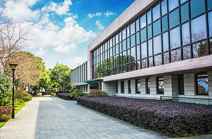 Sidewalk and side view of 2 story commercial office building